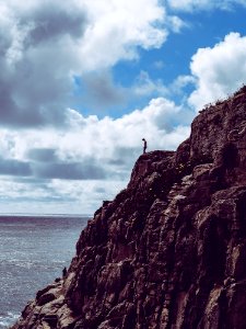 Person Standing On Cliff photo