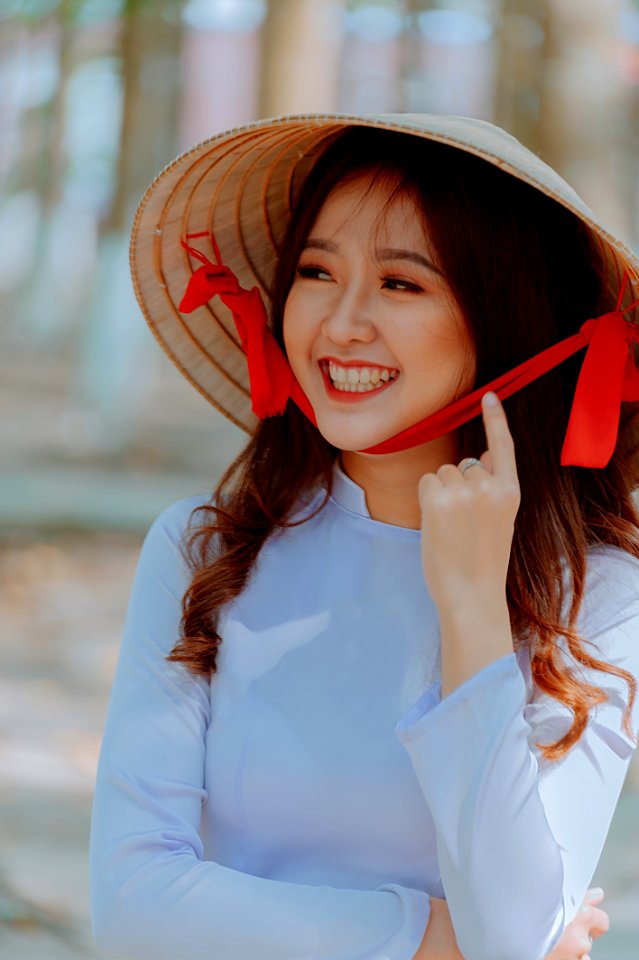 Close-Up Photography Of A Woman Wearing Straw Hat photo