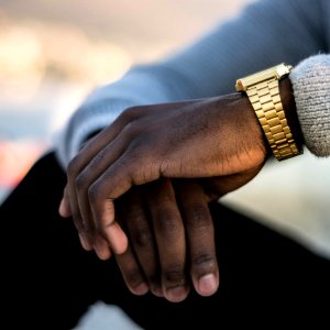 Man Wearing Gold-colored Wristwatch