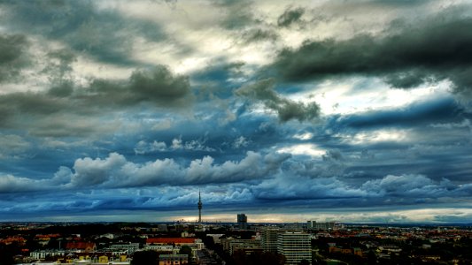 Photography Of The City Under Cloudy Skies photo