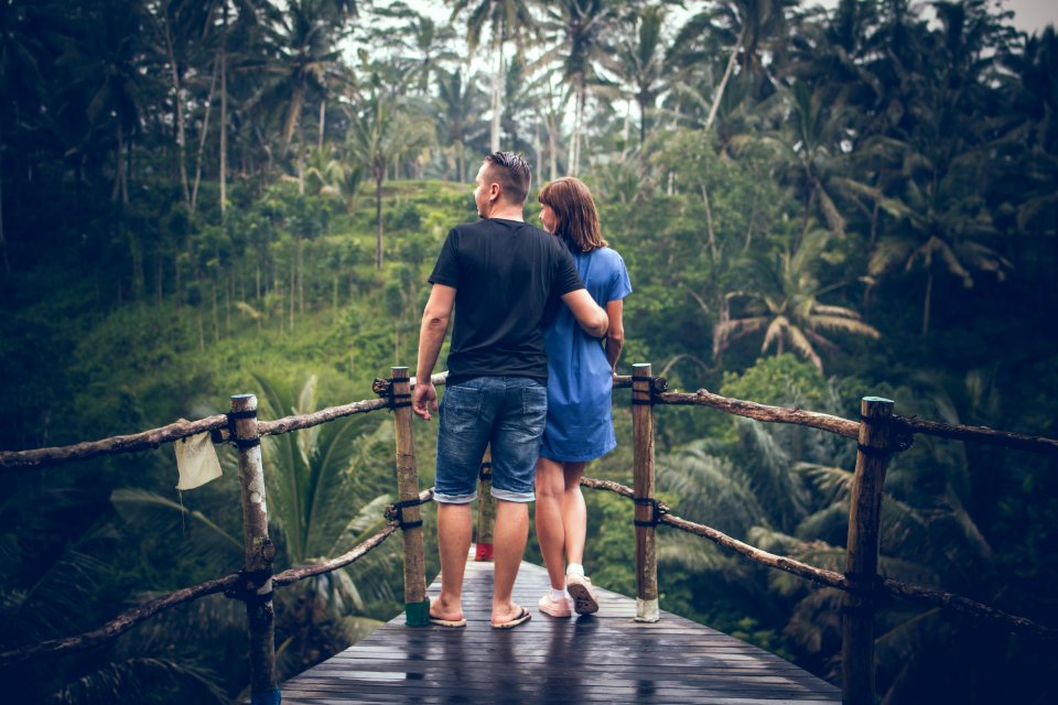 Man And Woman Standing On Hanging Bridge