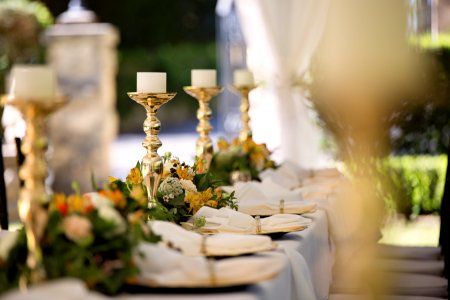 Selective Focus Of Candlesticks On Table With Wedding Set-up photo