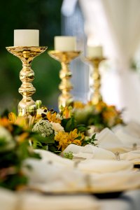 Selective Focus Photography Of Gold Candlestick On Table photo