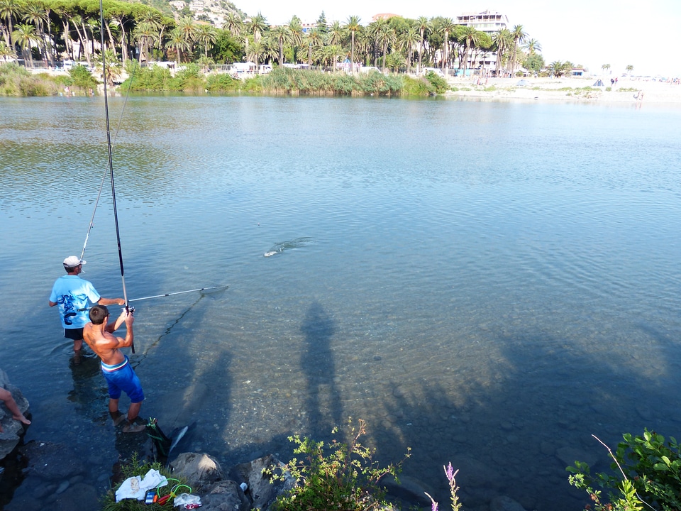 Water fisherman fishing rod photo