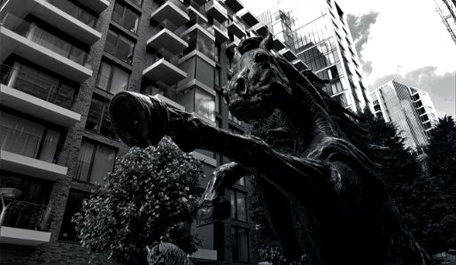 Grayscale Photo Of Concrete Horse Statue