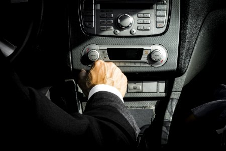 Man In Black Suit Inside Car