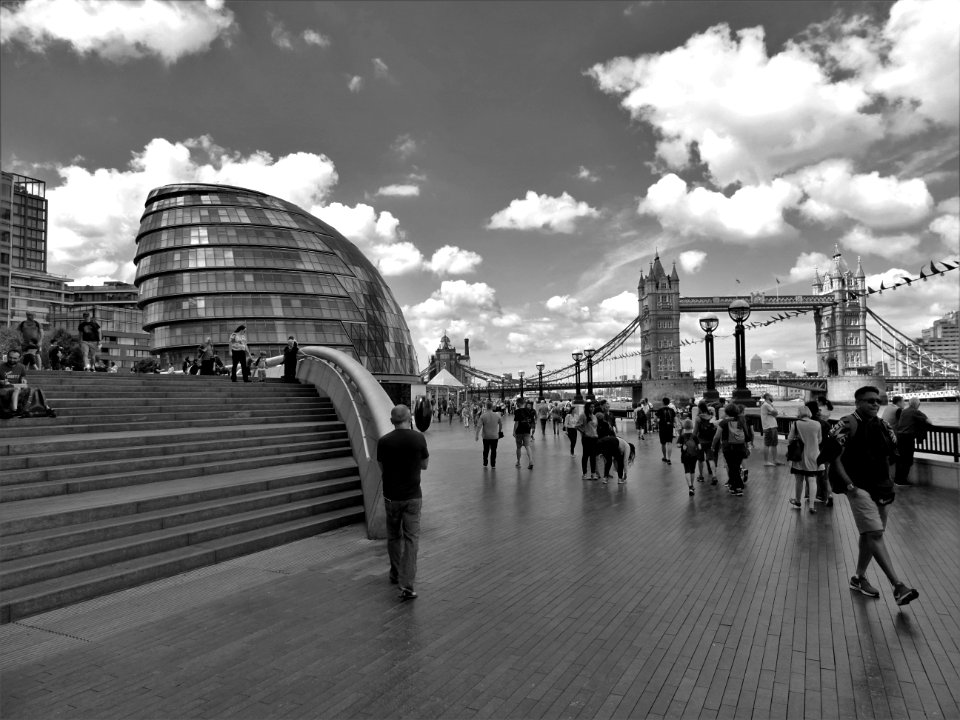 Grayscale Photo Of People Walking Near Tower Bridge At London photo