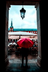 Person Holding Red Umbrella