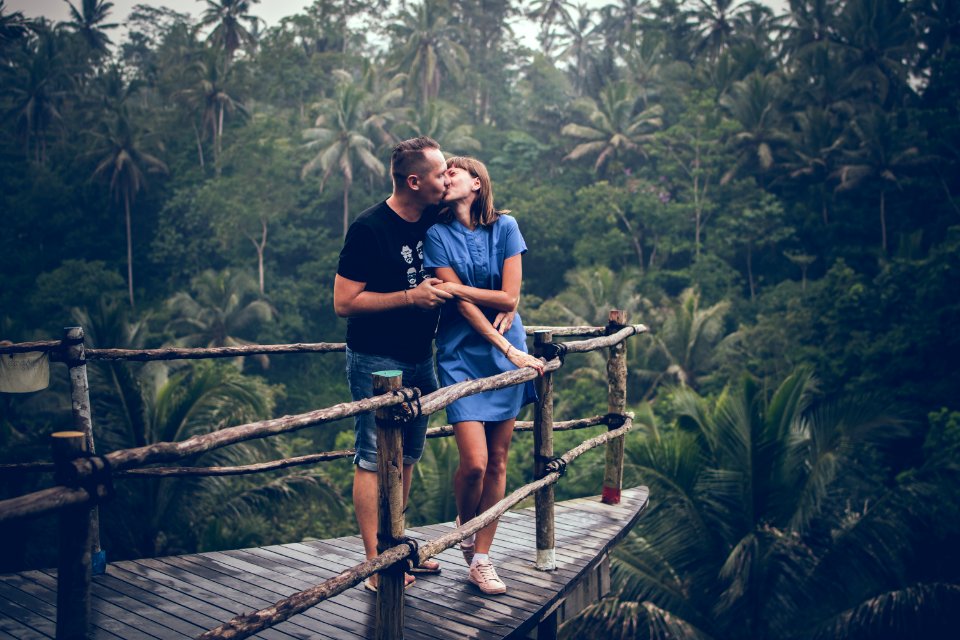 Man Kissing Woman On Cliff photo