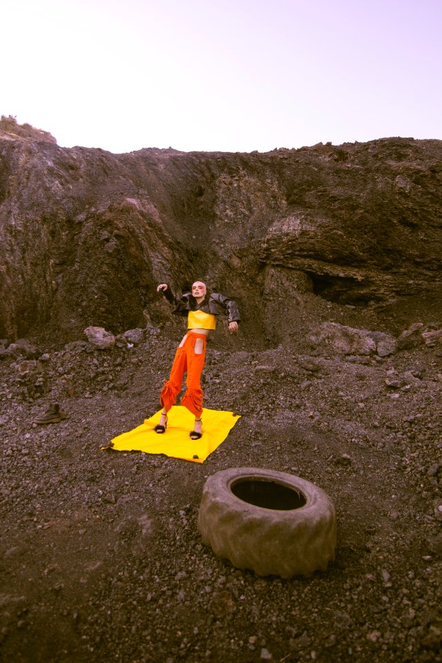 Person Standing On Mountain