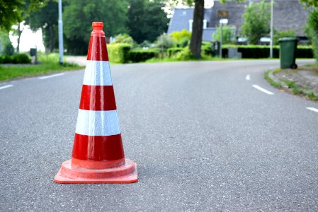 Red And White Traffic Cone On Road photo