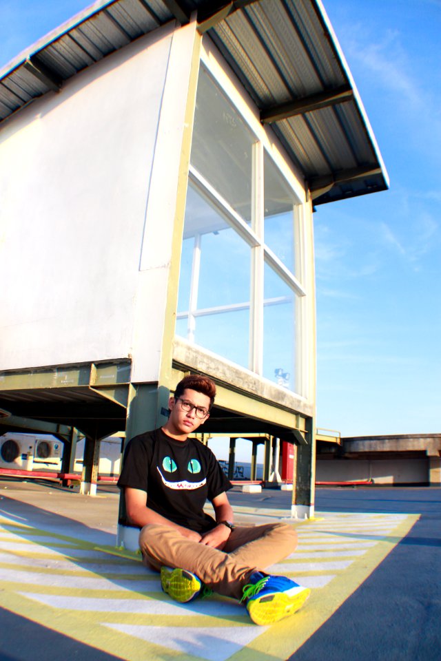Man Sitting On Ground
