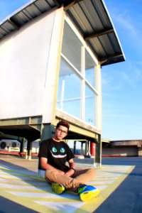 Man Sitting On Ground