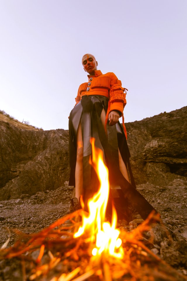 Man Wearing Orange Long-sleeved Shirt And Black Bottoms photo