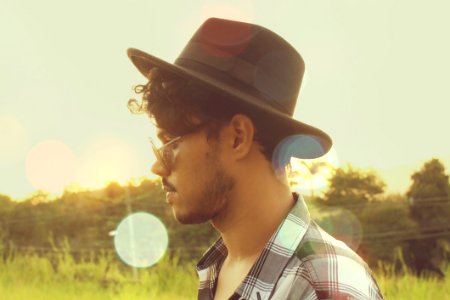 Man Wearing Black Hat And Sunglasses photo