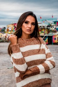 Woman Wearing Knitted White And Brown Stripe Sweater