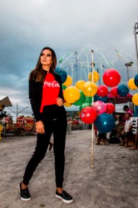 Woman Standing Near Hanging Balls