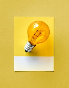 Brown Light Bulb Photo On Yellow Surface photo