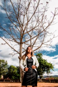 Photo Of Woman Standing Near Tree photo