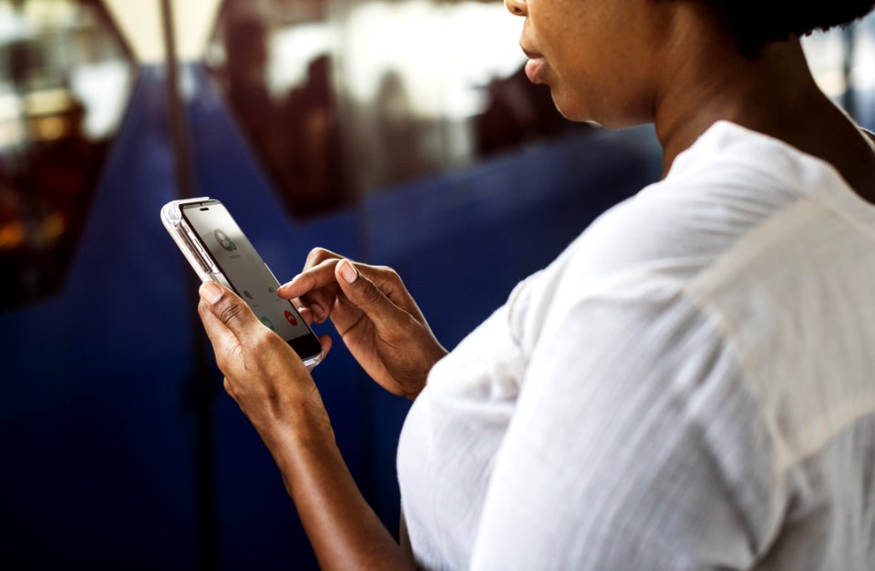 Woman Tapping On Phone