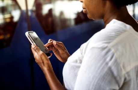 Woman Tapping On Phone