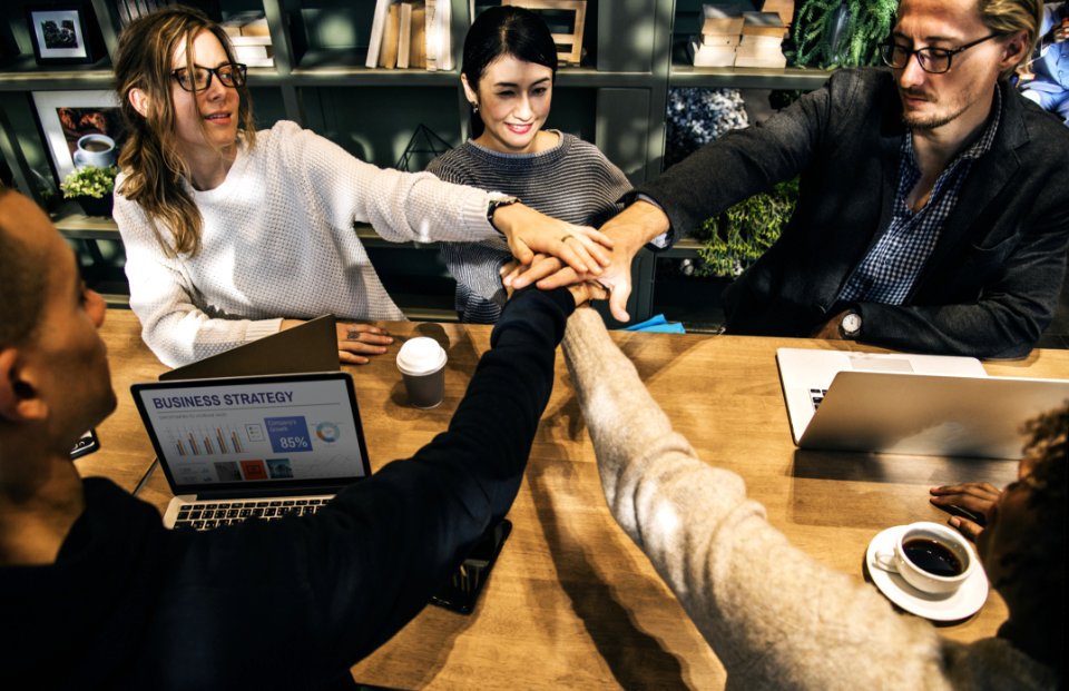 Group Of People Holding Hands Forming Teamwork photo