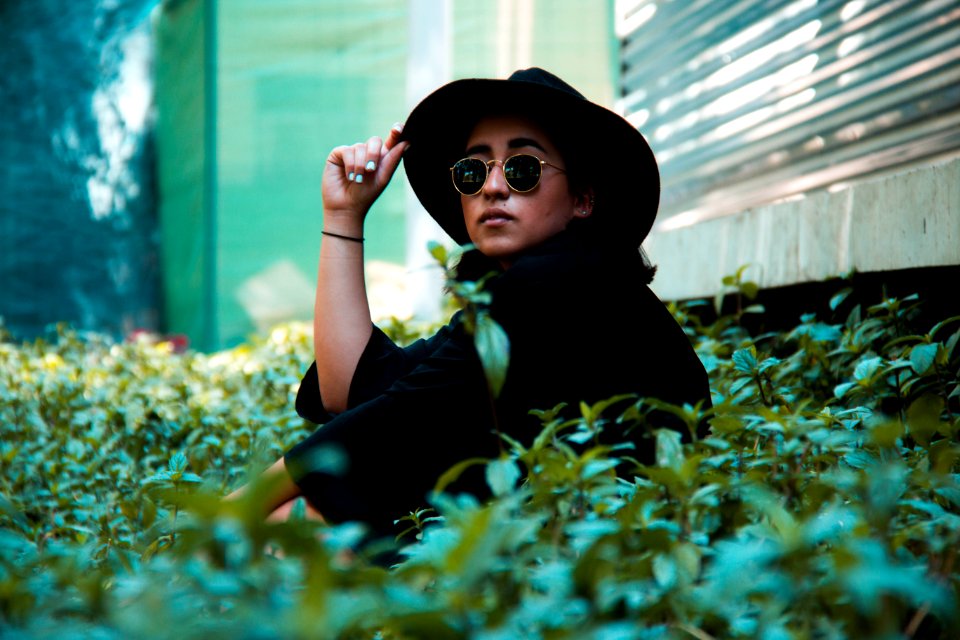 Person In Black Top Wearing Black Bucket Cap