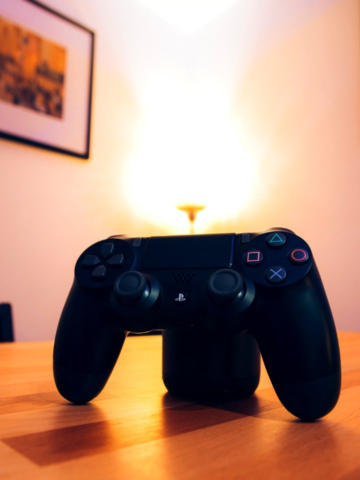 Black Sony Ps4 Dualshock 4 On Tabletop photo