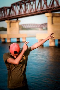 Man Wearing Gray T-shirt And Pink Cap photo