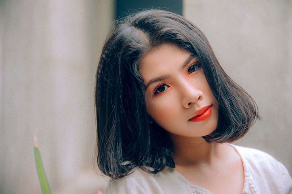 Photo Of A Woman Wearing White Top