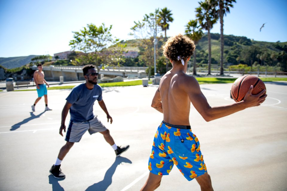 Three Man Playing Basketball