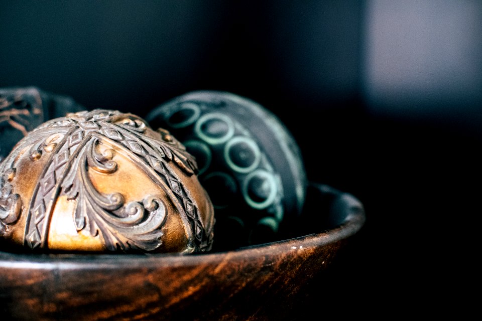 Brown And Two Black Ball In Bowl Photography