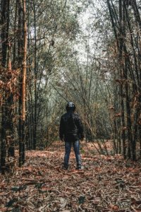 Person Wearing Black Bubble Jacket And Blue Jeans photo