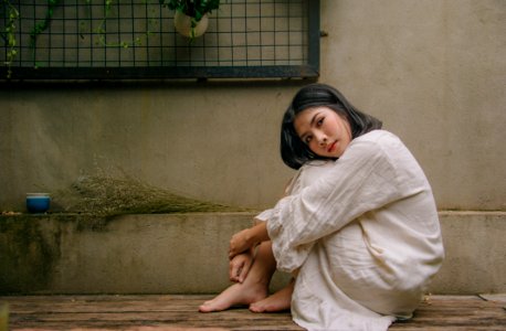 Photo Of Woman Sitting Down On Floor photo