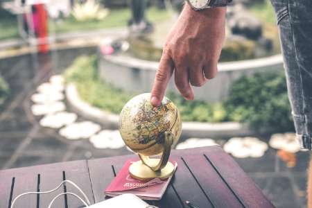 Person Holding Terrestrial Globe Scale Model Taken photo