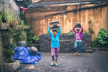 Photography Of People Carrying Cinder Blocks photo
