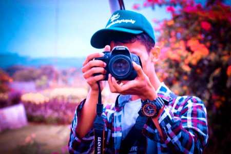 Shallow Focus Photography Of A Man Holding Camera photo
