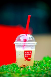 Close-Up Photography Of Plastic Cup With Dome Lid photo
