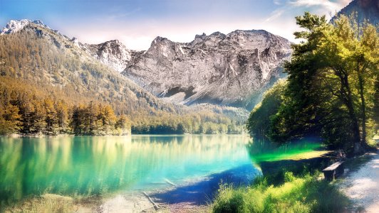 Landscape Photo Of Calm Body Water Between Trees And Mountain photo