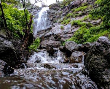 Timelapse Photography Of Waterfalls Under Cumulus Nimbus Clouds photo