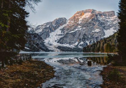 Landscape Photography Of Body Water Across Mountain photo