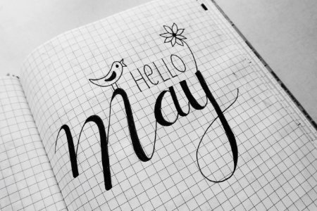 White Graphing Paper With Hello May Text photo