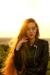 Woman Wearing Black Leather Bikers Jacket And Sunglasses