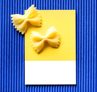 Farfalle Pasta On A Yellow Card photo