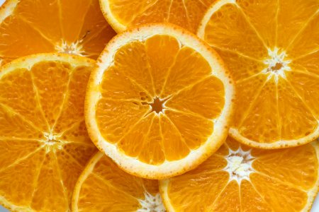 Closeup Of Sliced Juicy Oranges Textured Background