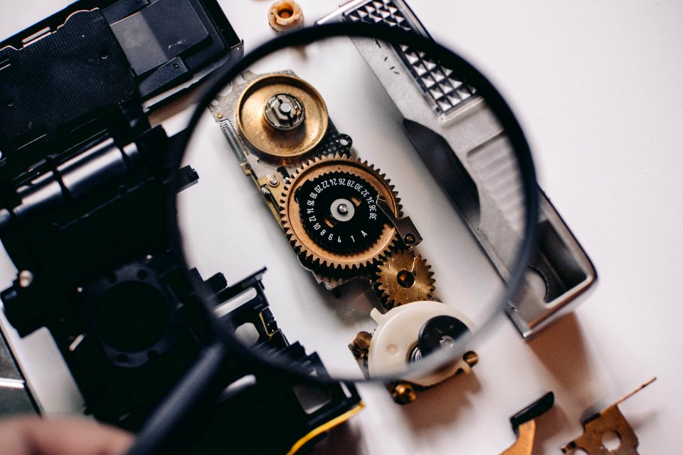 Shallow Focus Photography Of Magnifying Glass With Black Frame