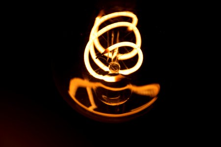 Close-Up Shot Of Light Bulb photo