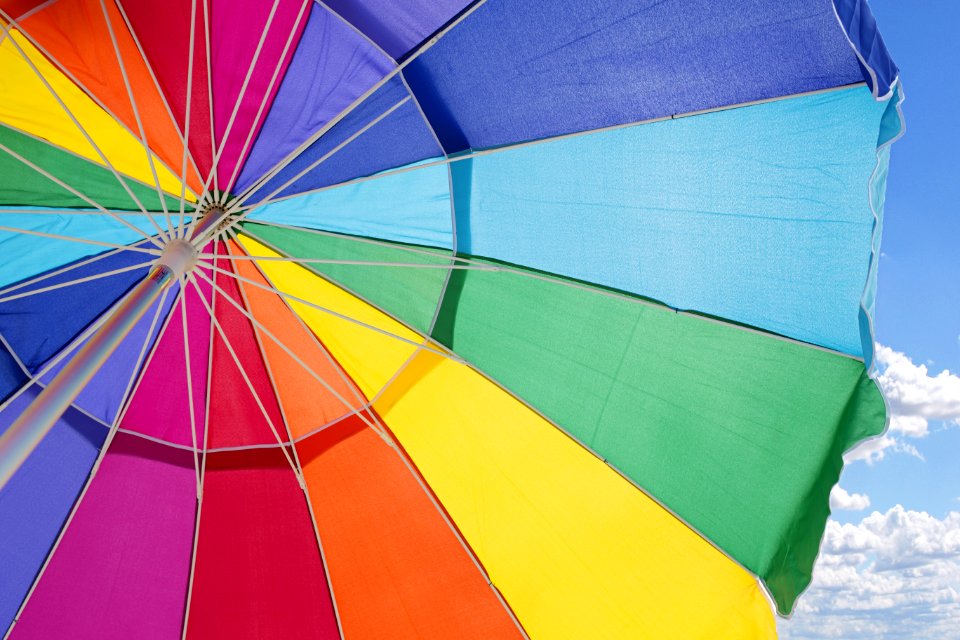 Multicolored Outdoor Umbrella Under Cloudy Sky