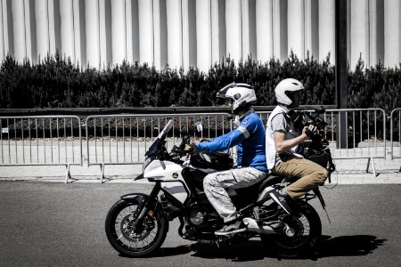Two Men Riding Motorcycle photo