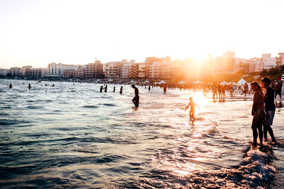 People At The Beach During Golden Hour